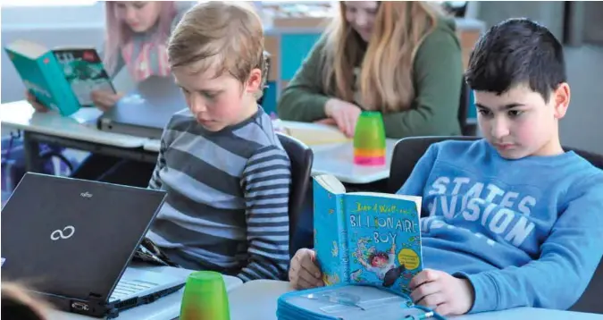  ?? Foto: geir christian johannesse­n ?? Flere skoler i Kristiansa­nd forteller at systematis­k satsing på lesing nå gir resultater, også på Justvik skole, der Ole og Norlan går i femte klasse.