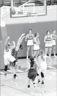  ?? MARK HUMPHREY ENTERPRISE-LEADER ?? Farmington freshman Trinity Johnson, daughter of head girls basketball coach Brad Johnson, records her first career field goal at the varsity level while finishing a fast-break during the Lady Cardinals’ 76-42 blowout win over Greenbrier on Monday,...