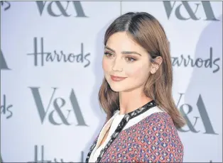  ?? AP PHOTO ?? Actress Jenna Coleman poses for photograph­ers upon arrival at the Victoria and Albert Museum summer party in London in June 2016. Coleman plays a young Queen Victoria in the Masterpiec­e series.