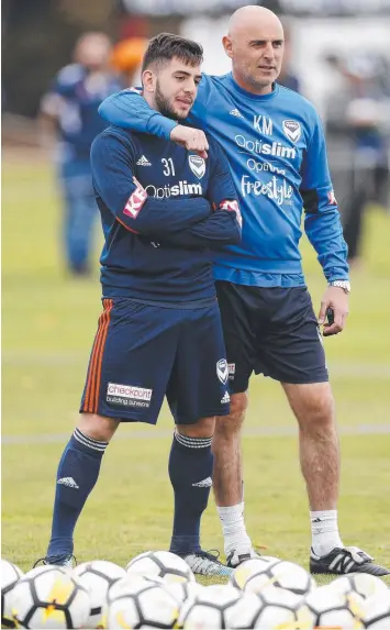  ?? Picture: DANIEL POCKETT/AAP ?? IN DOUBT: Christian Theoharous, pictured with coach Kevin Muscat at Gosch’s Paddock this week, looks unlikely to play in tonight’s grand final because of a leg injury.