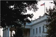  ?? EVAN VUCCI/AP PHOTO ?? An American flag above the White House flies at full-staff less than 48 hours after the death of Sen. John McCain, Monday. It was later lowered.
