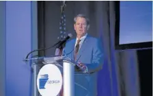  ?? AP PHOTO/STEPHEN B. MORTON ?? Georgia Gov. Brian Kemp speaks Thursday at the Georgia Ports Authority 2022 State of the Port address in Savannah, Ga.