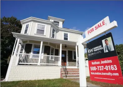  ?? (AP/Steven Senne) ?? A for sale sign stands in front of a house in early October in Westwood, Mass.