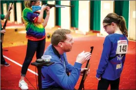  ?? NWA Democrat-Gazette/CHARLIE KAIJO ?? Jeremy Hawks (left) coaches Morgan Mapes, 10, of Norton County, Kan., on Monday during the Daisy Championsh­ips, at the John Q. Hammons Center in Rogers.