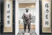  ??  ?? A life-size statue of judo founder Jigoro Kano is seen at the Mikage Public Hall in Kobe, Japan.