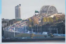  ?? Photos / Brett Phibbs ?? Traffic crawls southbound towards the Auckland Harbour Bridge after a truck crash damaged the central structure; water levels are low in the Lower Huia Reservoir in the Waitakere Ranges ( right).