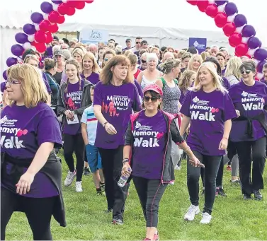  ??  ?? The assembled walkers get going at the Dalkeith walk.