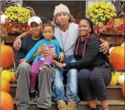  ?? PHOTO PROVIDED ?? Raolik Walls, center, is shown with his family, father Thomas Walls, his daghter Zaylii and mother Yvonne Ketter-Walls.