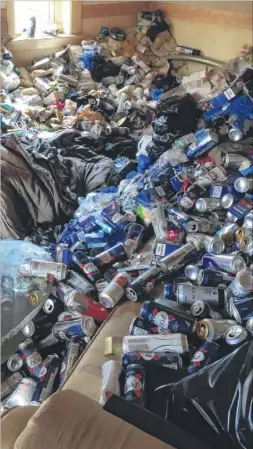  ??  ?? Graham Holland had to remove hundreds of beer cans and sacks of rubbish from his rented flat