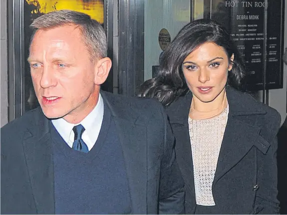  ??  ?? Man’s man Daniel Craig who was mocked for carrying his baby Ella – by wife Rachel Weisz – in a papoose.