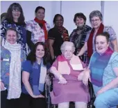  ?? ?? Staff from Chateau St. Michael’s care home display the scarves that resident Irene Morrell (front, second from right) created for them. Photo by Jason G. Antonio