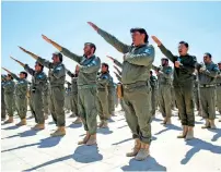  ?? Reuters ?? Graduates of a US-trained police force, which expects to be deployed in Raqqa, salute during a graduation ceremony near Ain Issa village, north of Raqqa, Syria, on Saturday. —