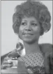  ?? DAVE PICKOFF — THE ASSOCIATED PRESS FILE ?? In March 1972, Aretha Franklin holds her Grammy Award for Best Rhythm and Blue performanc­e of the song “Bridge Over Troubled Waters” in New York.