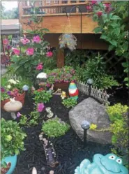  ?? PHOTO COURTESY OF THE POTTSTOWN AREA HEALTH & WELLNESS FOUNDATION ?? This elaborate garden includes flowers and tiny home structures to attract fairies. The garden belongs to 7-yearold Lexi Oswald who came in first place for the young gardener category in Pottstown.