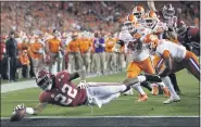  ?? DAVID J. PHILLIP — THE ASSOCIATED PRESS ?? Alabama’s Najee Harris reaches for the end zone during College Football Playoff championsh­ip game against Clemson, on January 7, 2019, in Santa Clara, Calif.