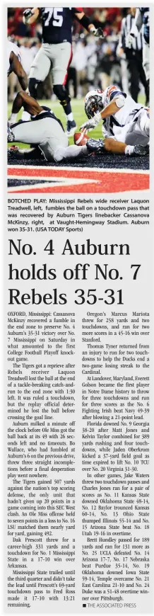  ??  ?? BOTCHED PLAY: Mississipp­i Rebels wide receiver Laquon Treadwell, left, fumbles the ball on a touchdown pass that was recovered by Auburn Tigers linebacker Cassanova McKinzy, right, at Vaught-Hemingway Stadium. Auburn won 35-31. (USA TODAY Sports)