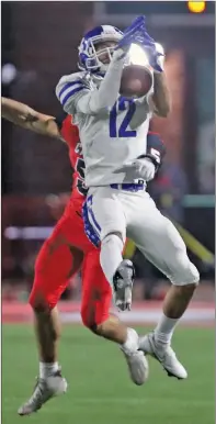  ?? RICK NATION/SPECIAL to The Saline Courier ?? Bryant junior defensive back Miguel Graham, 12, grabs an intercepti­on in a 45-20 Hornet win over Cabot on the road Friday.