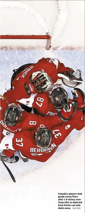  ?? REUTERS ?? Canada's players mob goalie Carey Price after 1-0 victory over Team USA as dejected Zach Parise can only skate away.