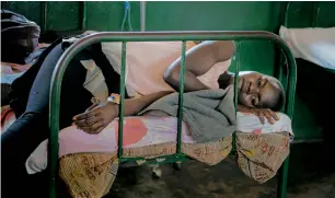  ?? AFP file ?? A patient rests on a bed after being discharged from the malaria ward at Panyadoli Health Centre in Kiryandong­o refugee settlement, northweste­rn Uganda. —