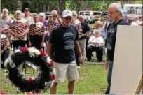  ??  ?? Two of U.S. Navy Petty Officer Francis Brown’s brothers place a wreath at a monument honoring their brother in Prospect Park during a ceremony Thursday marking the 50th anniversar­y of Brown’s death in an attack on the USS Liberty by Israeli fighter...