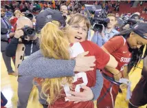  ?? ELAINE THOMPSON/ASSOCIATED PRESS ?? Stanford Hall of Fame coach Tara VanDerveer is shown embracing Brittany McPhee (12) after they beat Oregon State in the Pac-12 title game March 5.