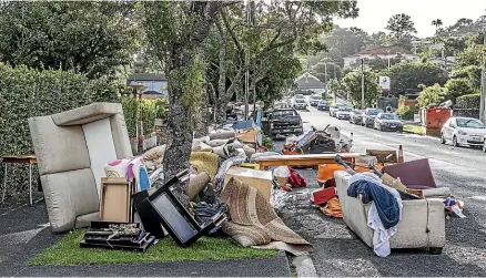  ?? RICKY WILSON/STUFF ?? Flood-damaged goods in Mt Eden awaiting clearance after the January 27 floods.