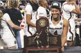  ?? NELL REDMOND VIA AP ?? SOUTH CAROLINA FORWARD ALIYAH BOSTON stands with the SEC regular season trophy after South Carolina defeated Georgia 73-63 in a game in Columbia, S.C., on Sunday.