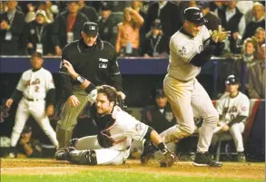  ?? Amy Sancetta / Associated Press ?? The Yankees’ Derek Jeter, right, reacts after scoring as Mets catcher Mike Piazza, center, misses the tag during Game 3 of the 2000 World Series.