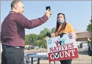  ?? MATTHEW BROWN — THE ASSOCIATED PRESS ?? Activist Lauri Dawn Kindness, right, speaks at the Crow Indian Reservatio­n, in Lodge Grass, Mont. on Aug. 26, 2020, as Lodge Grassmayor Quincy Dabney records her for a social media campaign to increase Native American participat­ion in the U.S. census.