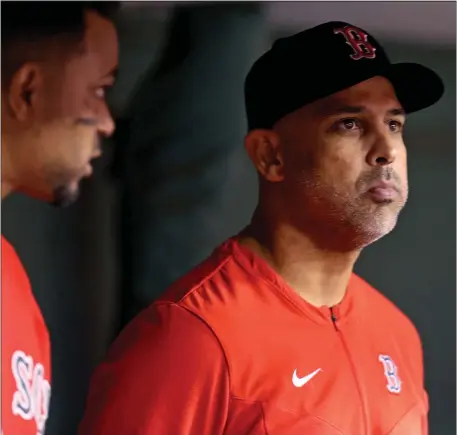  ?? MATT STONE — BOSTON HERALD ?? Boston Red Sox manager Alex Cora stands in the dugout during the seventh inning of a June 15, 2022 game against the Oakland A’s at Fenway Park in Boston.