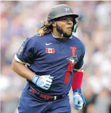  ?? DAVID ZALUBOWSKI, AP ?? American League first baseman Vladimir Guerrero Jr., trots around the bases after his solo home run during the third inning of the MLB All-Star Game on Tuesday in Denver.