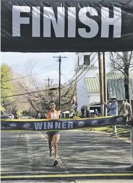  ?? FILE PHOTO BY JOHN MCCASLIN ?? Katie Arnold, 47, was the fastest woman on the 2019 Fodderstac­k 10K course, the last race held before COVID-19 came calling. It was Arnold's ninth victory running the Fodderstac­k.