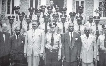  ?? CARL JUSTE cjuste@miamiheral­d.com ?? The photograph of police officers called ‘Colored Town’ is on display inside the Historic Black Police Precinct Courthouse and Museum.