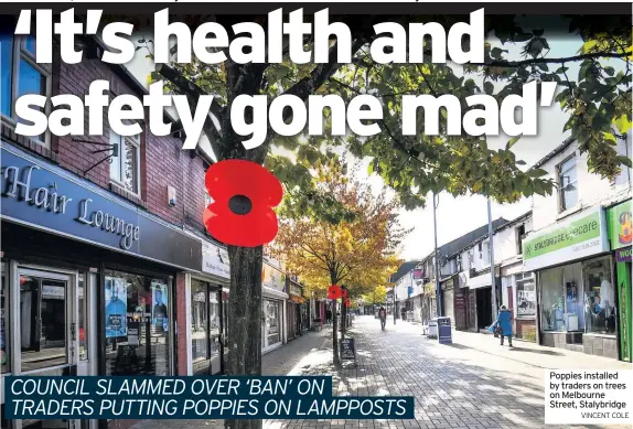  ?? VINCENT COLE ?? Poppies installed by traders on trees on Melbourne Street, Stalybridg­e