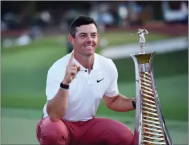  ?? MARTIN DOKOUPIL — THE ASSOCIATED PRESS ?? Rory McIlroy of Northern Ireland is posing with the trophy for his fourth win of the DP World Tour season after finishing fourth in DP World Tour Championsh­ip in Dubai, United Arab Emirates on Sunday.