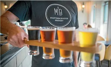  ??  ?? Martinboro­ugh Brewery’s $10 tasting paddle offers great bang for your buck, and will hit the spot on a sunny day.