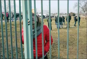  ?? VISAR KRYEZIU — THE ASSOCIATED PRESS ?? Ukranian refugees wait for family members to arrive at Medyka border crossing in Poland on Feb. 26. The United Nations says that more than 3.6 million people have fled Ukraine since the war started one month ago.