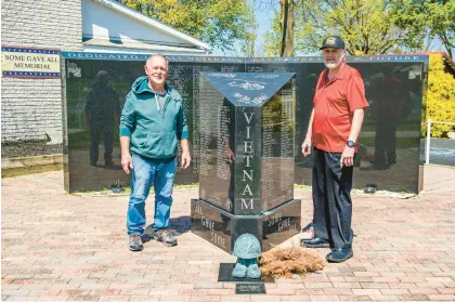  ?? APRIL GAMIZ/THE MORNING CALL ?? Veterans Otto Harazim, left and Larry Deibert stand April 29 at the Some Gave All Memorial in front of the Macungie Veterans of Foreign Wars hall. This year marks the 25th anniversar­y for the memorial, formerly known as the Lehigh Northampto­n Vietnam Veterans Memorial.