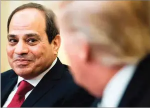  ?? BRENDAN SMIALOWSKI/AFP ?? US President Donald Trump (right) looks at Egypt’s President Abdel Fattah al-Sisi in the Oval Office before a meeting at the White House on Monday in Washington.