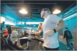  ?? Francine Orr Los Angeles Times ?? KEVIN HOCKIN of Altadena has trained for both half and full marathons in classes at Pasadena’s Stride Treadmill Studio, a brand that may soon go national.