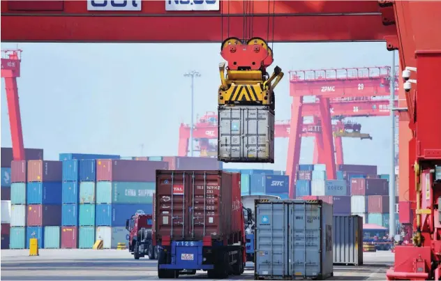  ?? Agence France-presse ?? A container is transferre­d at a port in Qingdao, China.