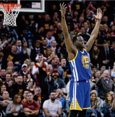  ??  ?? Draymond Green, above, exults during Game 3, while Stephen Curry and Kevin Durant, right, bump heads in the fourth quarter, when the Warriors came back to win. Following, Curry gets a pickup from center David West during the championsh­ip-clinching Game...