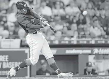  ?? Elizabeth Conley / Houston Chronicle ?? George Springer connects for a solo home run off A’s starter Trevor Cahill in the bottom of the fifth inning Sunday, putting the Astros up 3-1. It was Springer’s second consecutiv­e game with a long ball.