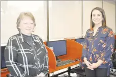  ?? RACHEL DICKERSON/MCDONALD COUNTY PRESS ?? Velta Strong, library assistant (left) and Amy Wallain, library director, are pictured on March 4 with computers about to be replaced at the Pineville branch of the McDonald County Library. The library received a grant that will provide for new computers.