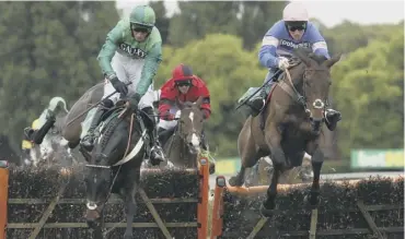  ??  ?? 0 Call Me Lord ridden by Daryl Jacob (left), on the way to victory at Sandown in April.