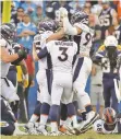 ?? MARCIO JOSE SANCHEZ/ASSOCIATED PRESS ?? Broncos players celebrate after their winning field goal against the Chargers on Sunday in Carson, Calif. Denver won, 23-22.