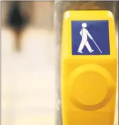  ?? Getty Images ?? A button to push for a walk signal.