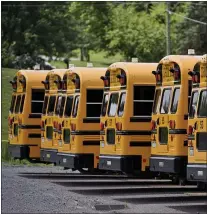  ?? MEDIANEWS GROUP FILE PHOTO ?? A line of school buses at Eshelman Transporta­tion in Robeson Township, Pa.