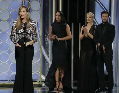  ?? PAUL DRINKWATER/THE ASSOCIATED PRESS ?? Allison Janney accepts her award for best supporting actress in I, Tonya at Sunday’s Golden Globes ceremony. Janney was one of many actors who wore black to the awards show. For a partial list of winners, see A3. Full coverage at thestar.com.