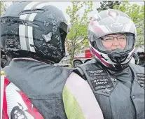  ?? ASHLEY FITZPATRIC­K/THE TELEGRAM ?? Rider Sherri Gosse (right) awaits the start of the 2016 Ride for Dad in St. John’s. Cold temperatur­es and damp conditions kept riders, but not donors, away from the event this year.